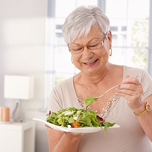 Woman eating salad in Oklahoma City
