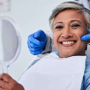 You can speed up the adjustment period for your new dentures by practicing speaking with them in your mouth.