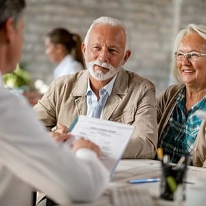 elderly couple at a denture consultation