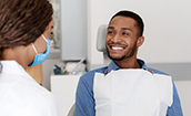 Patient smiling at his Oklahoma City emergency dentist