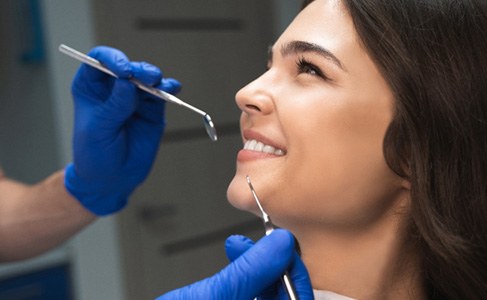 woman smiling during dental checkup    