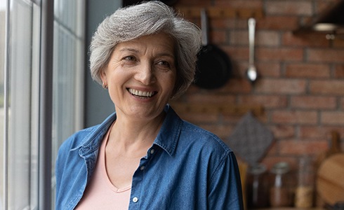 Woman learning dental implant care in Oklahoma City