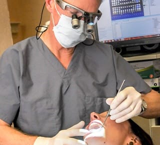 Doctor Hermen treating a dental patient