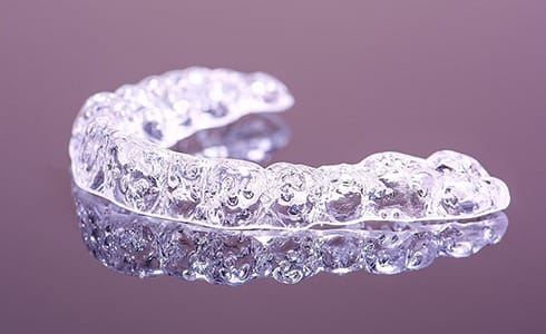 Aligner used for Invisalign FAQs in Oklahoma City. 