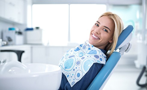 Woman visiting dentist for a smile makeover in Oklahoma City