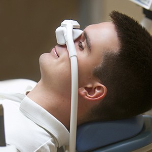 Smiling man relaxing with nitrous oxide sedation in Oklahoma City