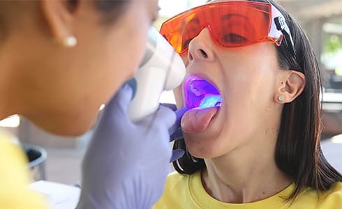 Patient receiving oral cancer screening