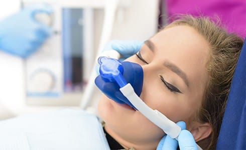 Woman receiving nitrous oxide dental sedation