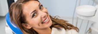 Woman smiling during preventive dentistry visit