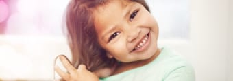 Young girl smiling during children's dentistry visit