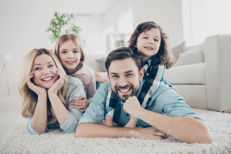 family showing off bright smiles in Oklahoma City