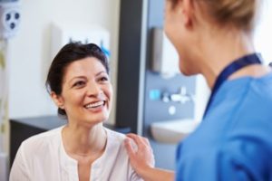 Patient visiting her dentist to receive dental bonding treatment.