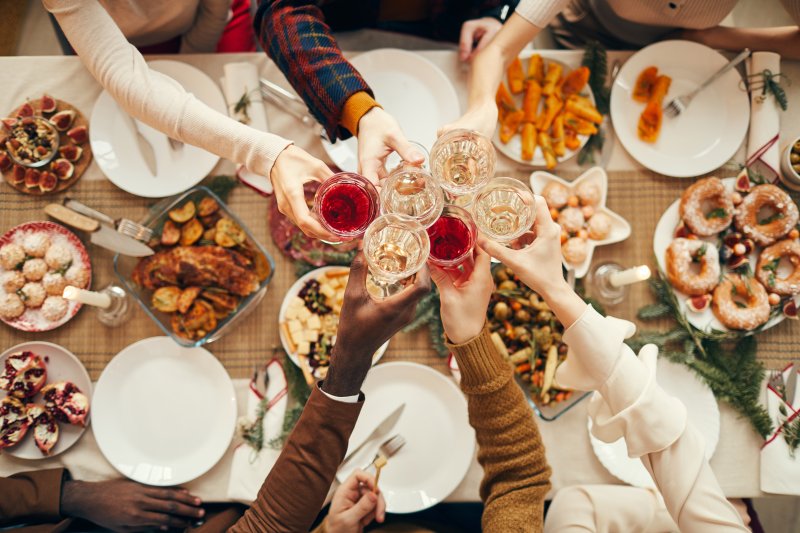 People at a seasonal dinner proposing a toast