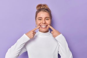 a patient smiling after getting a smile makeover