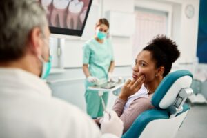 Woman in discomfort due to dental emergency